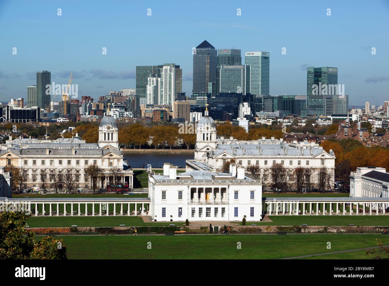 England - London - Greenwich - View from Greenwich Park in Autumn to the Royal Naval College, Queen`s House and the towers of Canary Wharf Stock Photo